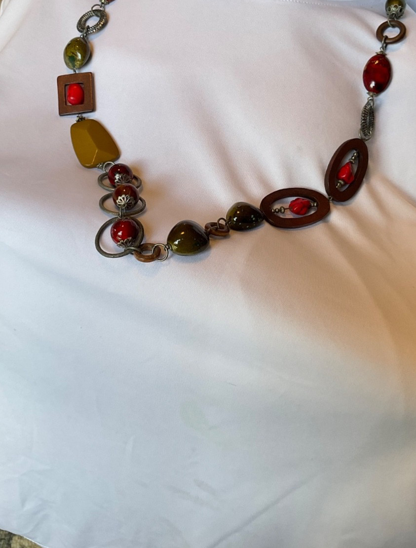 chicos 37” necklace featuring red, green and brown beads with geometric rings